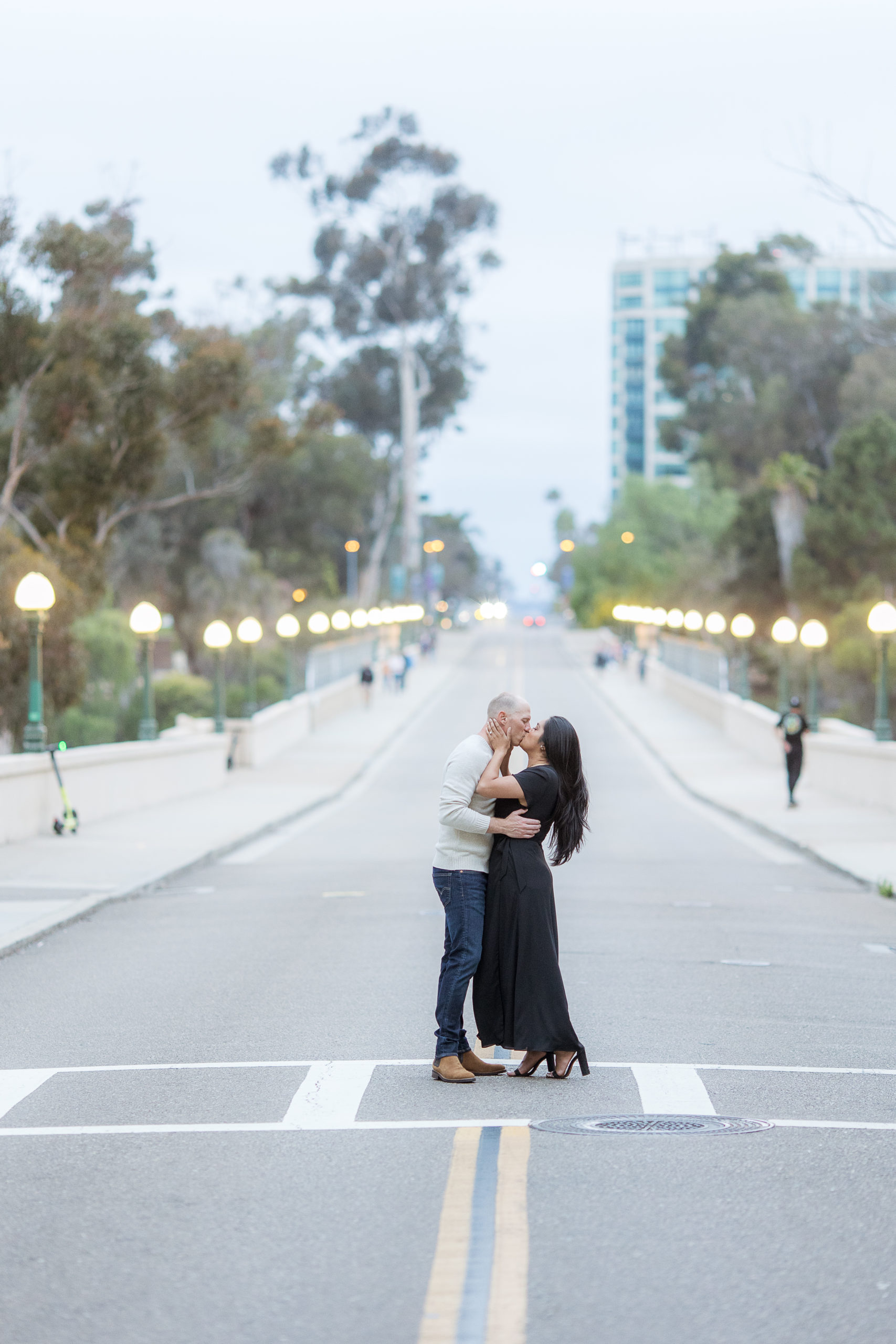 Danny & Kassy kiss in the street during their Balboa Park Engagement Session
